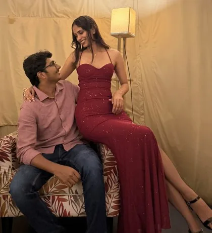 Celebrating her birthday, her in a red gown